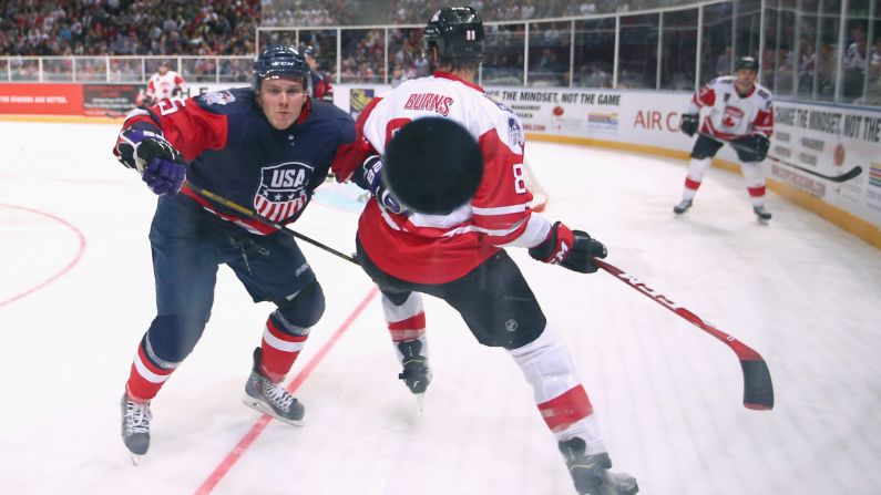 U.S. hockey player Matt Williams watches the puck hit the glass during an exhibition game against Canada on Saturday, June 6. The exhibition series, the Ice Hockey Classic, is taking place in Australia.