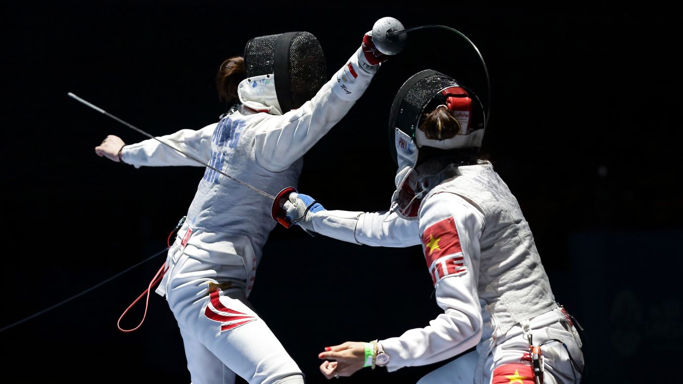 Singaporean fencer Wong Mae Hui Shan Nicole, left, competes against Vietnam's Nguyen Thi Hoai Thu at the Southeast Asian Games on Wednesday, June 3. Nguyen won the quarterfinal match 15-6.