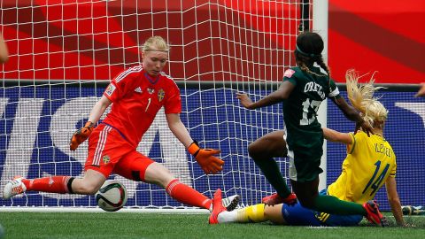 Francisca Ordega of Nigeria scores past Swedish goalkeeper Hedvig Lindahl.