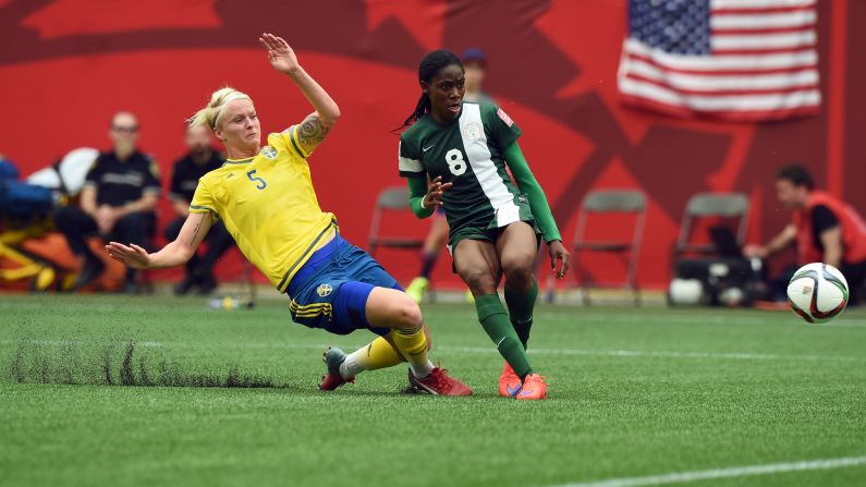 Nigeria forward Asisat Oshoala, right, scores a goal against Sweden during a Women's World Cup match June 8 in Winnipeg. The game ended in a 3-3 draw.