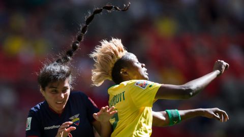 Ecuador's Nancy Aguilar, left, and Cameroon's Gaelle Enganamouit collide.