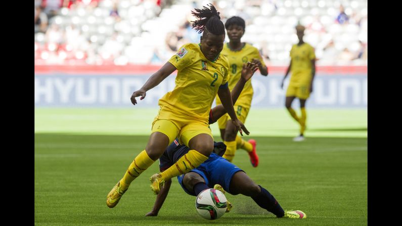 Christine Manie of Cameroon jumps to avoid the tackle of Monica Quinteros.