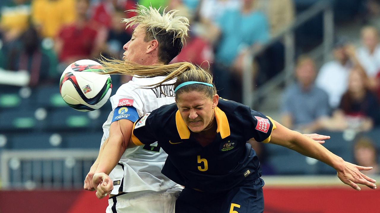 U.S. captain Abby Wambach, left, controls the ball near Australian defender Laura Alleway.