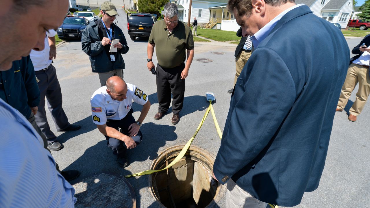 New York Gov. Andrew Cuomo, right, is shown the manhole where <a href="http://www.cnn.com/2015/06/06/us/new-york-escapees/index.html" target="_blank">two convicted murderers escaped</a> from the Clinton Correctional Facility in Dannemora, New York, on Saturday, June 6, 2015. Police say Richard Matt, 48, and David Sweat, 34, escaped from the maximum-security prison using power tools.