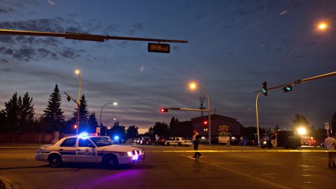 Police contain the shooting scene.