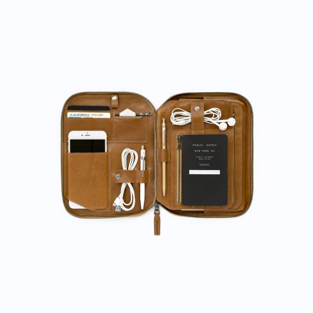 In addition to being able to carry the standards like a phone and tablet, the Mod Tablet 2 has separate inserts for cords, keys, city guides, books and reading glasses.