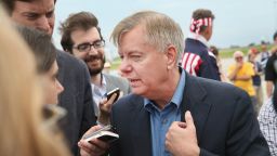 Republican presidential hopeful Senator Lindsey Graham (R-SC) greets guests at a Roast and Ride event hosted by freshman Senator Joni Ernst (R-IA) on June 6, 2015 in Boone, Iowa.