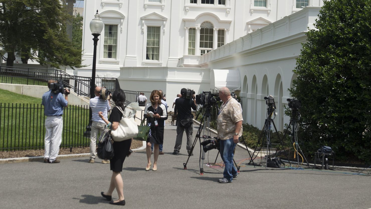 Members of the press evacuate from the Press Briefing Room at the White House following a bomb threat.