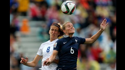 Jill Scott of England and Amandine Henry of France compete for a header.