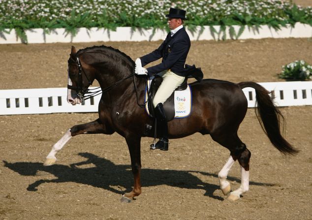Jan Brink of Sweden wears classic attire as he competes in the individual dressage grand prix freestyle event during the Athens 2004 Summer Olympic Games. 