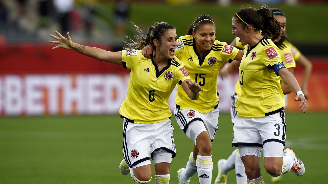 Colombian midfielder Daniela Montoya, left, celebrates her goal with teammates Tatiana Ariza, center, and Natalia Gaitan.