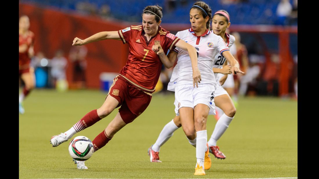 Spain's Natalia Pablos tries to dribble past Costa Rica's Carol Sanchez during a match June 9 in Montreal. The match ended 1-1.