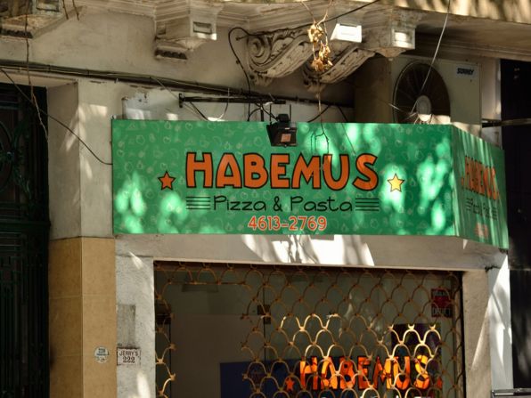 This pizzeria is named after the traditional 'Habemus Papam' announcement following a Pope's election. The Pope's popularity has helped local businesses. A team of Argentinian ice cream makers has even presented the Pope with his own flavor.