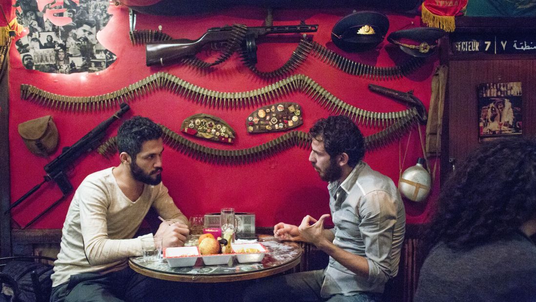 Two men have a conversation at Abu Elie, a bar in Beirut, Lebanon.