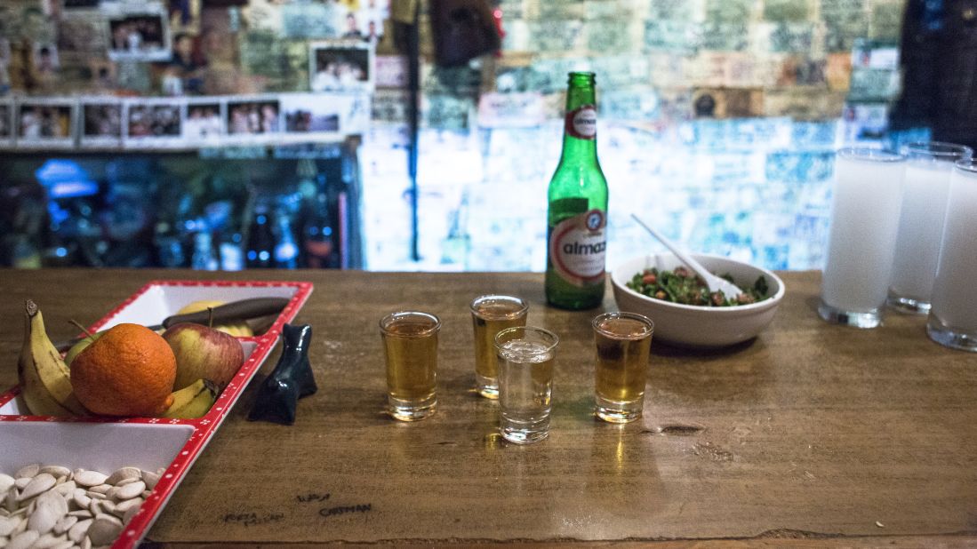 Shots await CNN's Anthony Bourdain and Ernesto, the son of the owner of Abu Elie bar. Seen on the bar, a bottle of Almaza beer. The brand was founded in 1933 and, until 2006, was practically the only beer brewed in Lebanon.