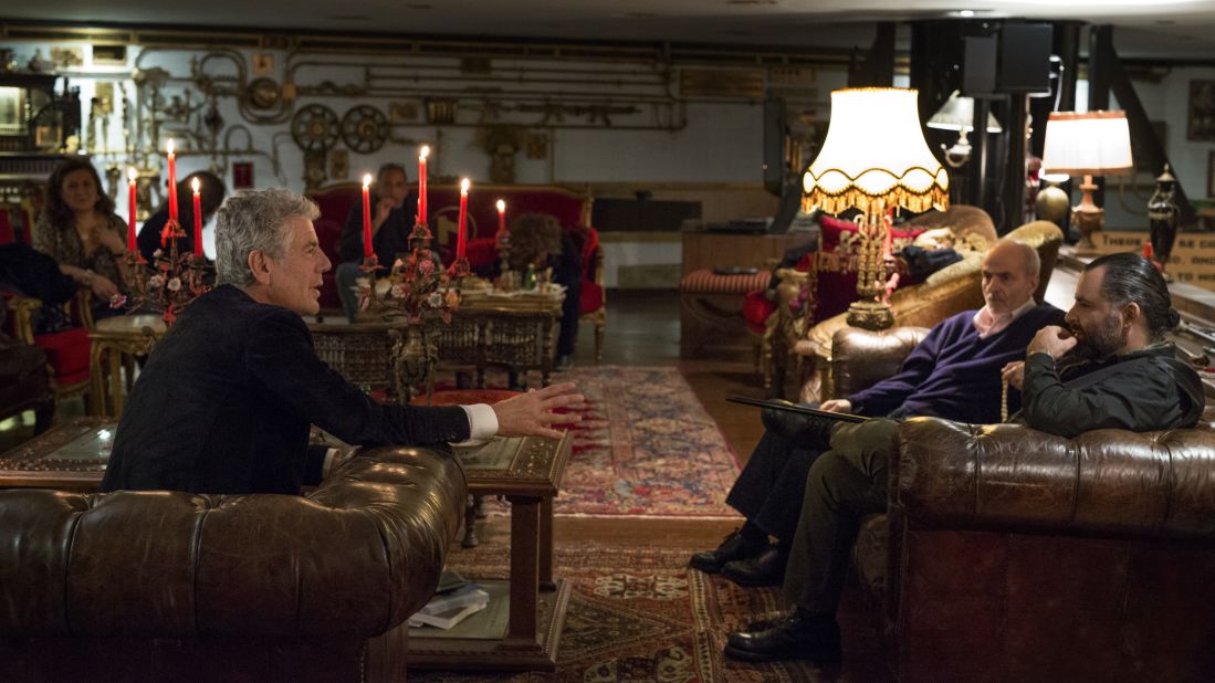 Anthony Bourdain chats with Michel Elefteriades, far right, the music producer, entrepreneur, politician, artist, author, filmmaker and founder of Beirut Music Hall. The venue, located in a once-abandoned theater in the center of the city, includes a night club, a theater and a restaurant.