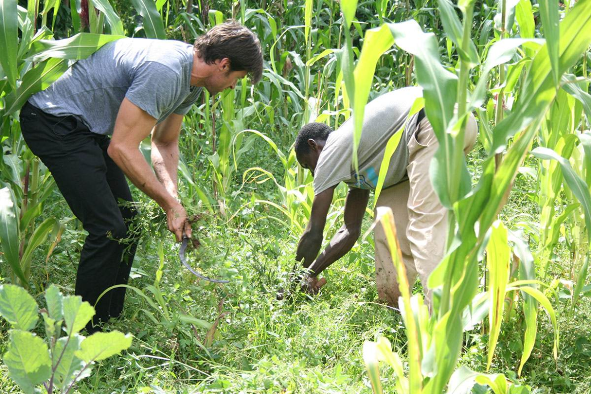 Jackman, seen here planting a tree with Dukale in Ethiopia, liked the taste of Dukale's coffee so much, he wanted to market it. His company, Laughing Man Coffee, recently partnered with Keurig.