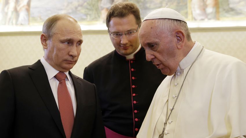 Russian President Vladimir Putin listens to Pope Francis on the occasion of a private audience at the Vatican, Wednesday, June 10.