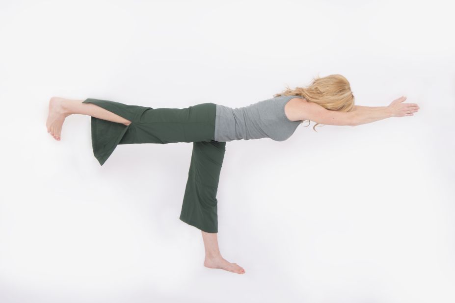Shift your weight into your right leg and begin to take weight off your left leg. Exhale fully to drop your rib cage and have better access to core muscles to help stabilize you. When you feel steady, reach your arms forward and left leg back along a horizontal line. Try to hold it for two or three breaths. Repeat on the other side.