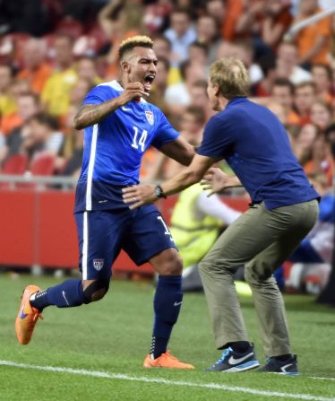 Danny Williams celebrates his equalizer against the Netherlands with coach Jurgen Klinsmann. His team were 3-2 down with just two minutes to go, but managed to turn the game around for a 4-3 win.