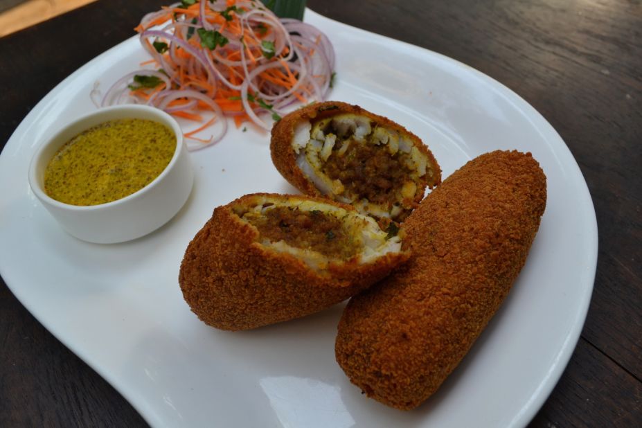 A crunchy bhekti fish roll, served with with mustard dip, on the menu Kolkata's 6 Ballygunge Place. 