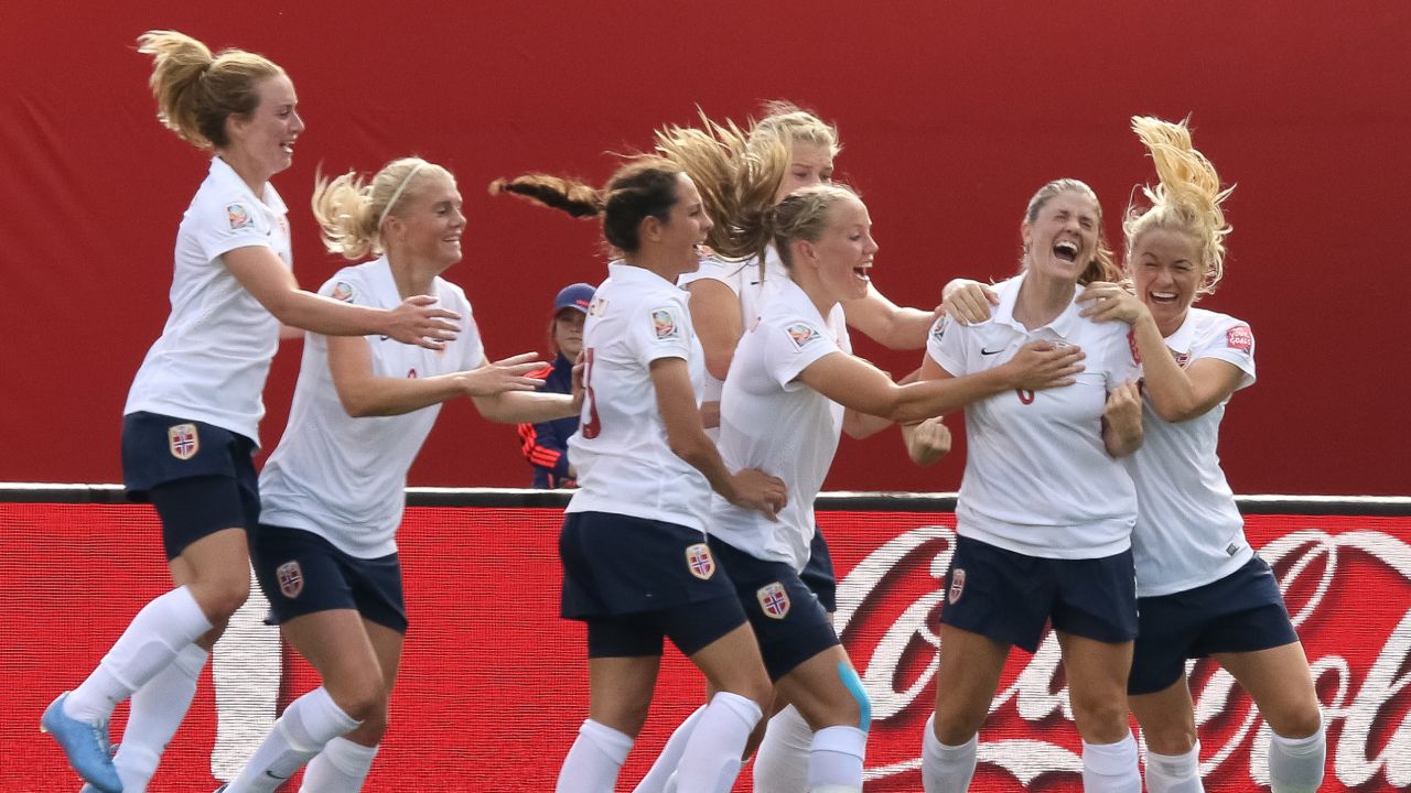 Norway's Maren Mjelde, second from right, celebrates with teammates after scoring on a free kick.
