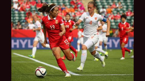 Mandy Van Den Berg of the Netherlands, right, defends Tang Jiali of China.