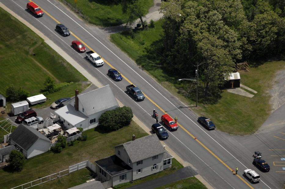 Authorities block a road in Cadyville during the manhunt on June 11.