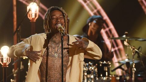 Rapper Wiz Khalifa  was held down by customs officials at Los Angeles International Airport on Saturday.