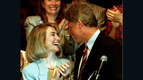 Democratic presidential nominee Bill Clinton is applauded by his wife Hillary on July 1992, before his address to the Women's Caucus of the 1992 Democratic National Convention.
