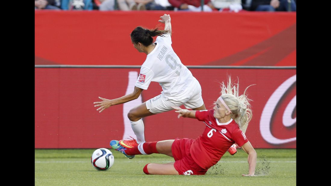 Canada's Kaylyn Kyle defends against New Zealand's Amber Hearn.