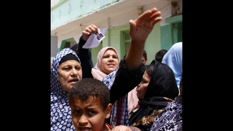 Mothers in Burj Mughayzil, Egypt, swarm around a CNN crew desperate for possible news of their missing sons. Many desperately poor families in Burj Mughayzil risk their children's lives by sending them to Italy on smuggler boats so that they can earn money to send home. But the risks are great, and the reality is more likely to be death at sea or detention on arrival.