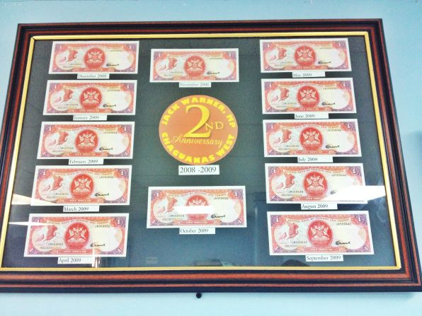 His office walls are adorned with several framed pictures of Trinidadian dollars -- $1 for each month. This is to "show" how little he earns each year from the role.
