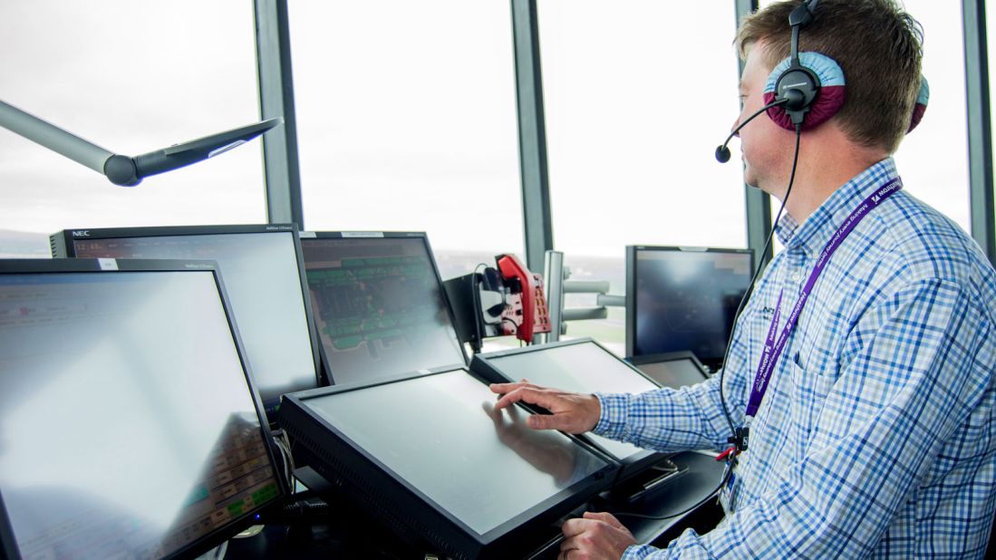 Jason Cooper is manager of "Red Watch," Heathrow control tower. "There's pressure, but no stress," Cooper says of his work. Heathrow's air traffic controllers are tasked with keeping a steady flow of air traffic so that runways constantly run at capacity levels. 