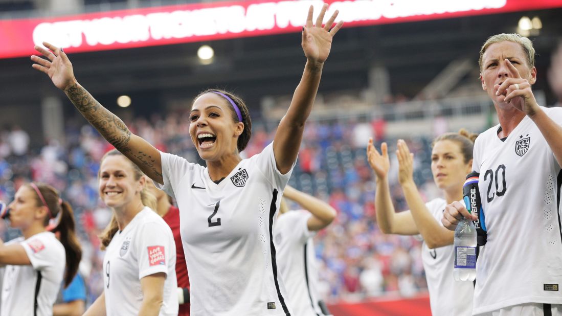 Leroux (No. 2), Wambach (No. 20) and other U.S. players celebrate after winning the Australia match.