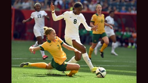 Nigeria forward Asisat Oshoala, right, is challenged by Australia defender Steph Catley during a match June 12 in Winnipeg. Australia won 2-0. 