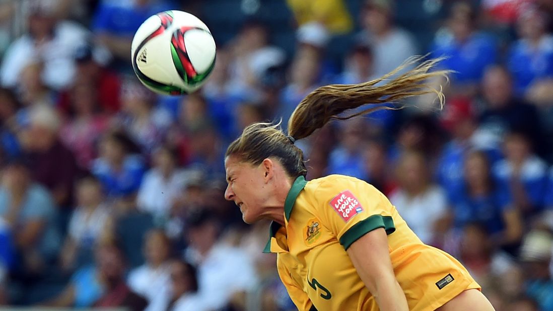 Australia defender Laura Alleway heads the ball. 