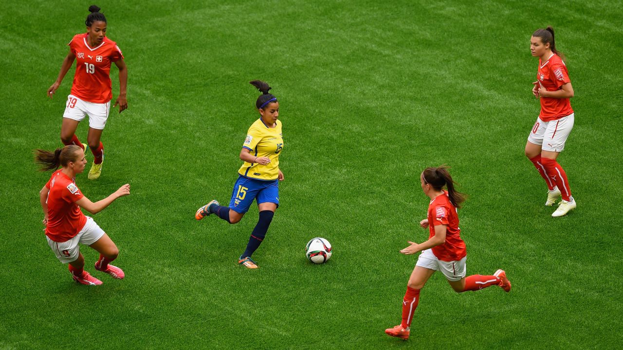 Ana Palacios of Ecuador is surrounded by Swiss defenders during a match June 12 in Vancouver. Ecuador lost 10-1.