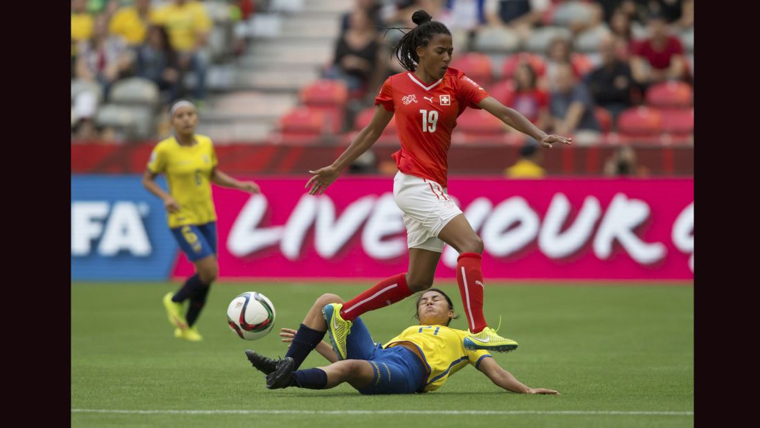 Ecuador's Mabel Velarde slides to take the ball away from Aigbogun. 