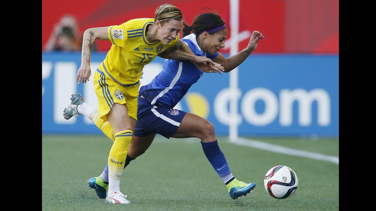 Therese Sjogran of Sweden, left, and Sydney Leroux of the United States chase down a ball during their scoreless draw June 12 in Winnipeg.