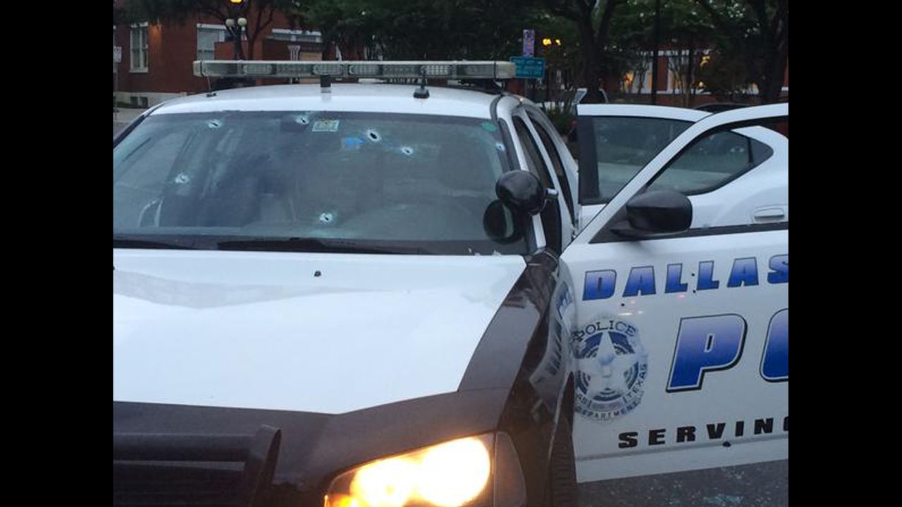Dallas police released a photo of a squad car struck by bullets. No officers were injured.