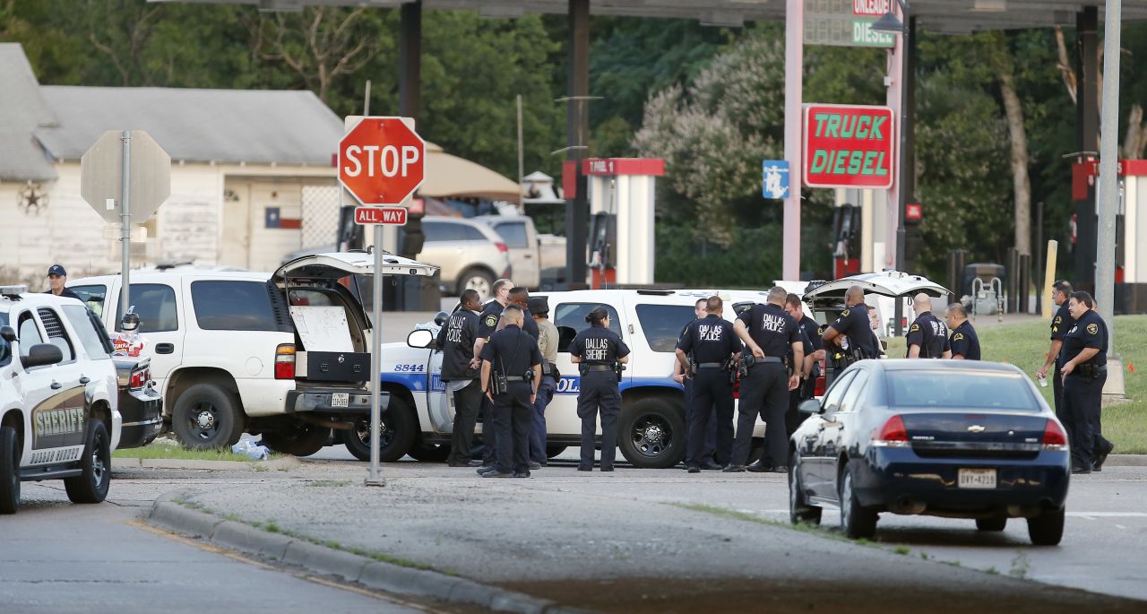 Police block the intersection of Dowdy Ferry Road and Interstate 45 near where the suspect was barricaded in a van. 