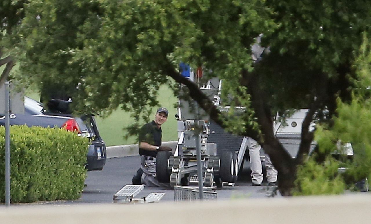 Police setup a remotely operated robot during the standoff.