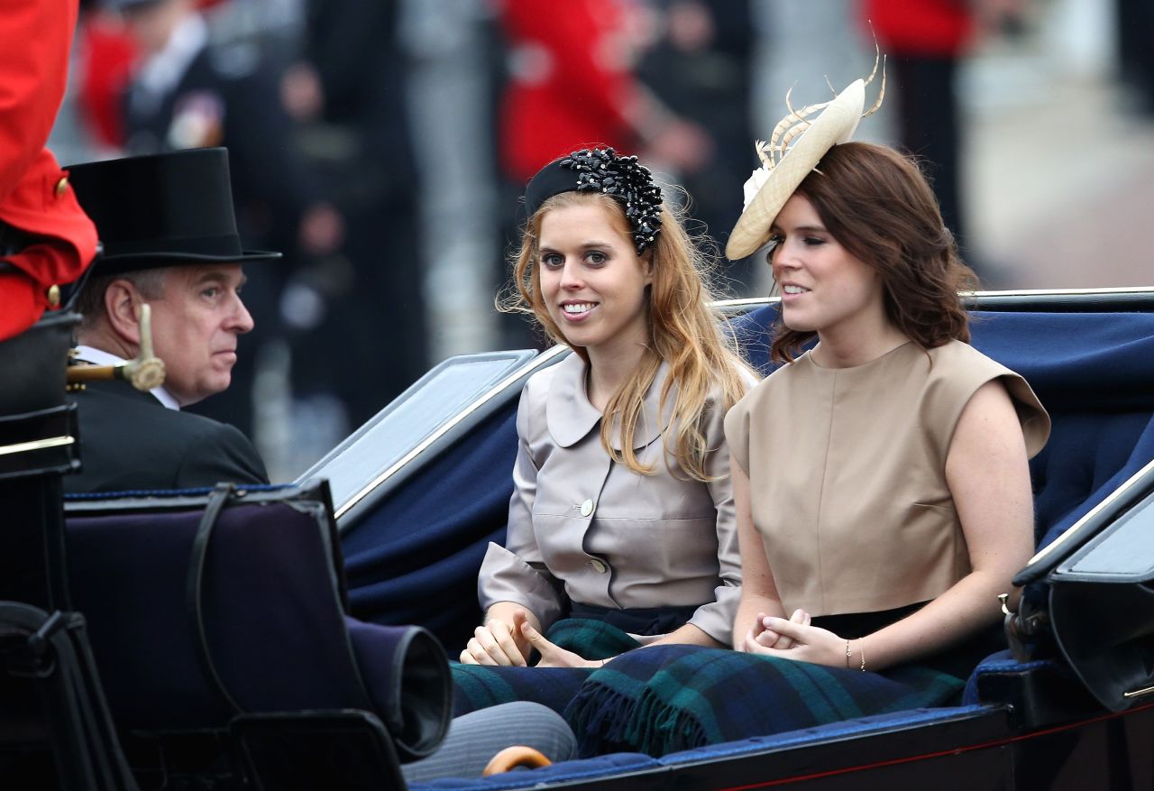 Prince Andrew, Duke of York, Princess Beatrice and Princess Eugenie arrive. 