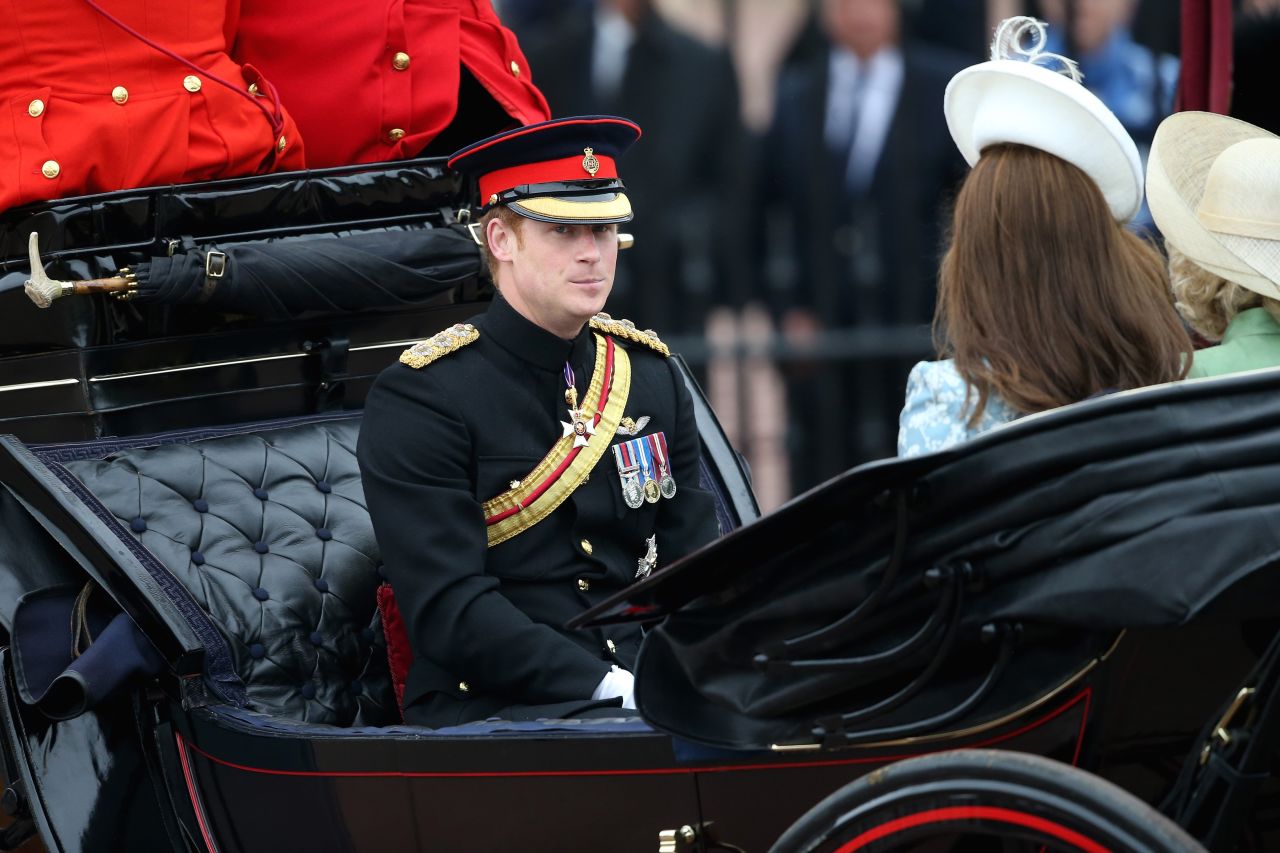 Prince Harry, Camilla, Duchess of Cornwall, and Catherine, Duchess of Cambridge arrive by carriage.