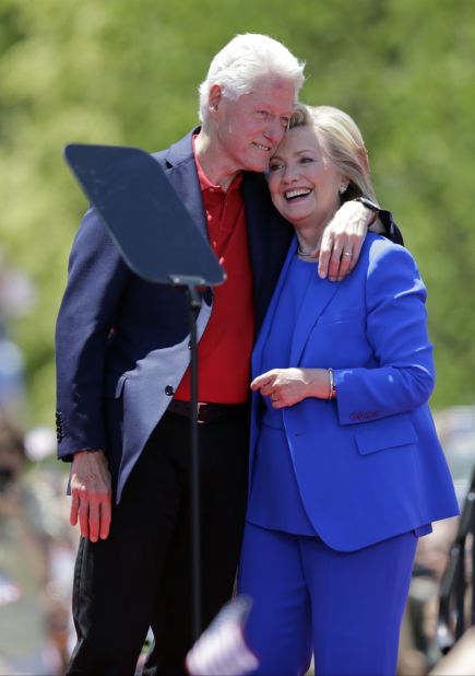 Hillary Clinton gets a hug from the former president.
