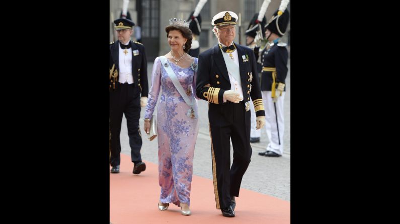 King Carl Gustaf and Queen Silvia arrive at the at the Royal Palace chapel for the wedding.