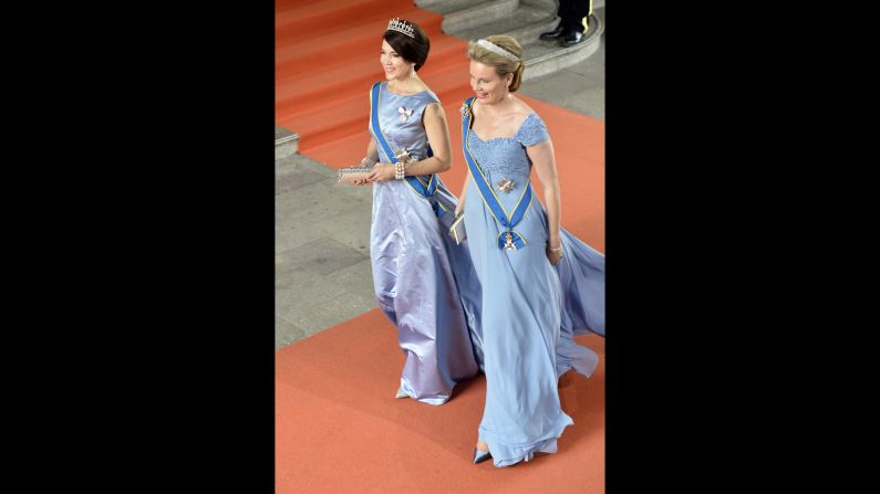 Crown Princess Mary of Denmark, left,  and Queen Mathilde of Belgium arrive.