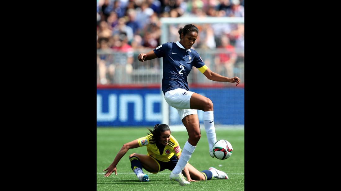 France's Wendie Renard takes the ball from Lady Andrade of Colombia. 