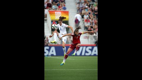England midfielder Jill Scott, left, and Mexico midfielder Nayeli Rangel battle for the ball.